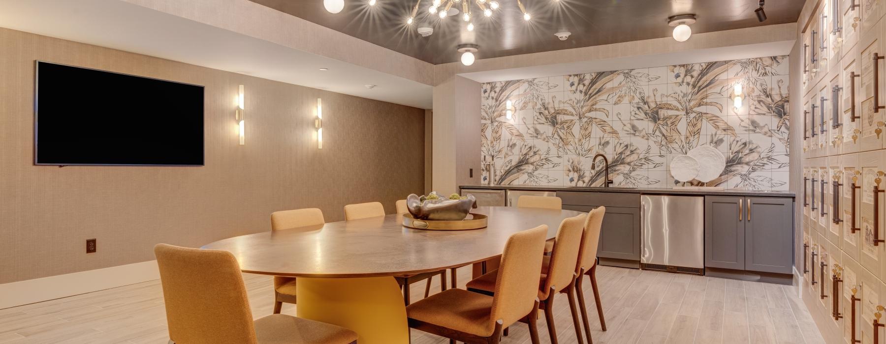 a dining room with a large chandelier and a table