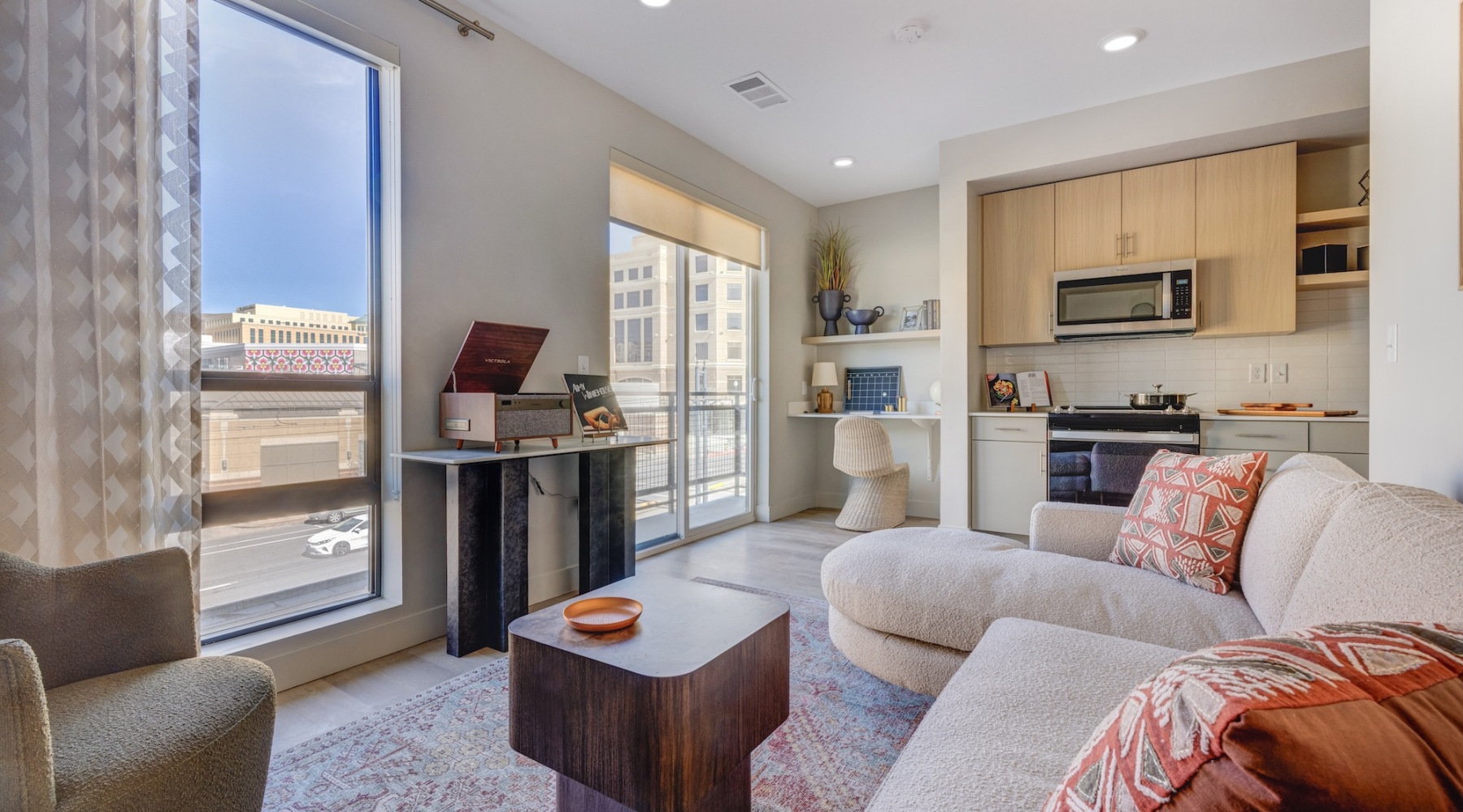 living room with seating dining room and several windows