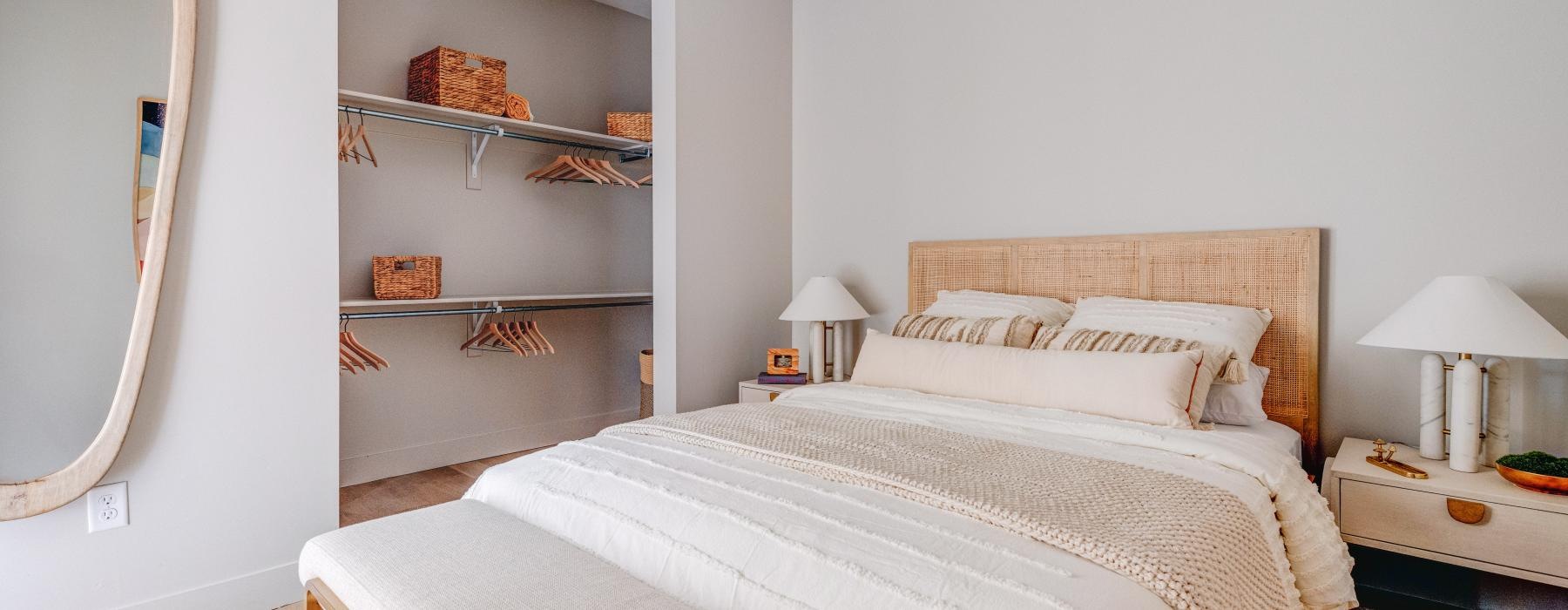 a bedroom with a large mirror