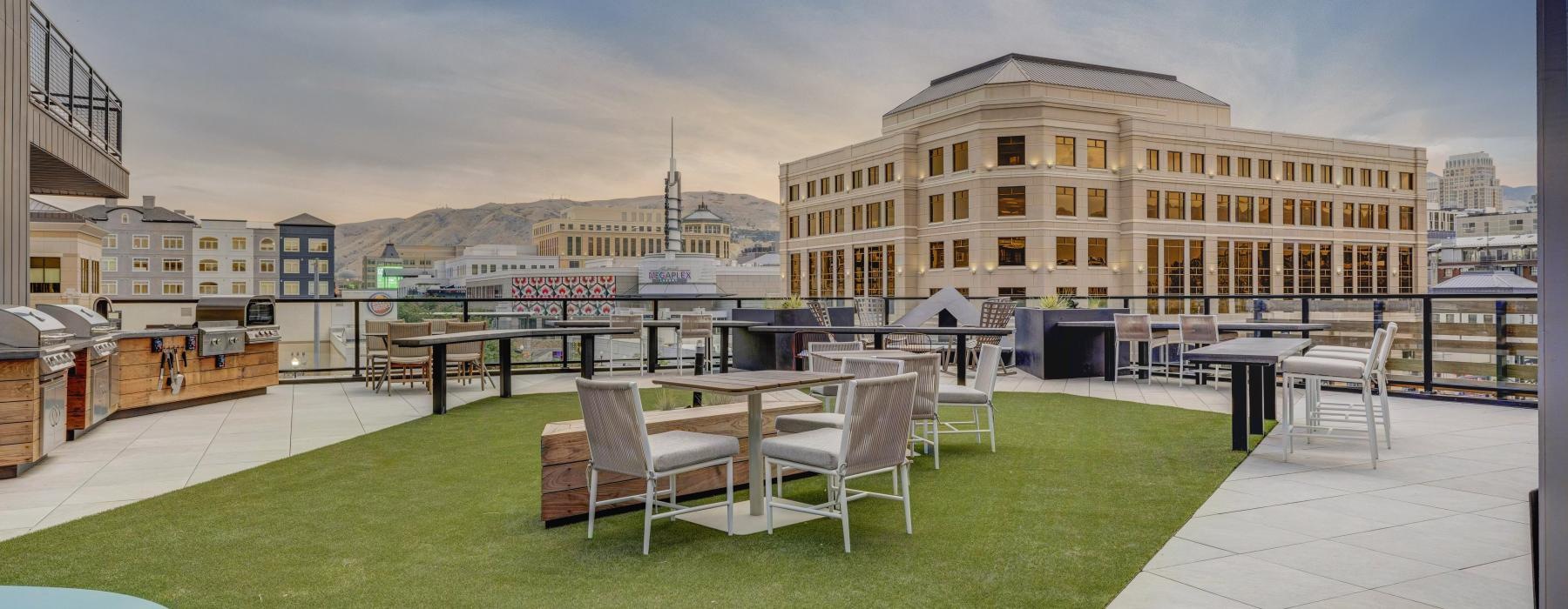 a courtyard with tables and chairs