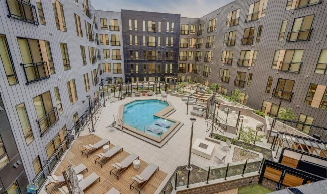 a pool in a courtyard between buildings